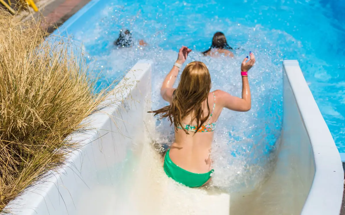 A girl sliding down the Halswell Summer Pool hydroslide.