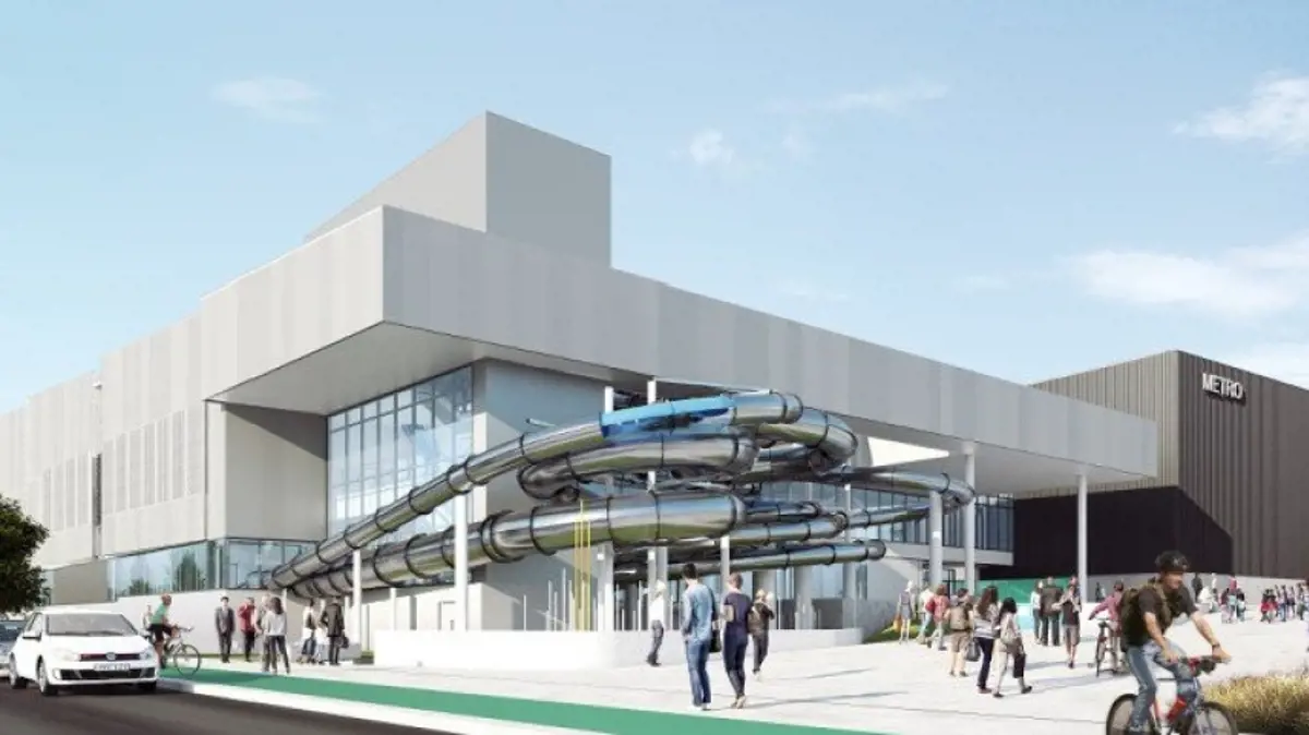 An artistic rendition of the outside of the Parakiore Rec Centre that includes a large white building with an outdoor hydro-slide, pedestrians on the footpath and cars driving past.