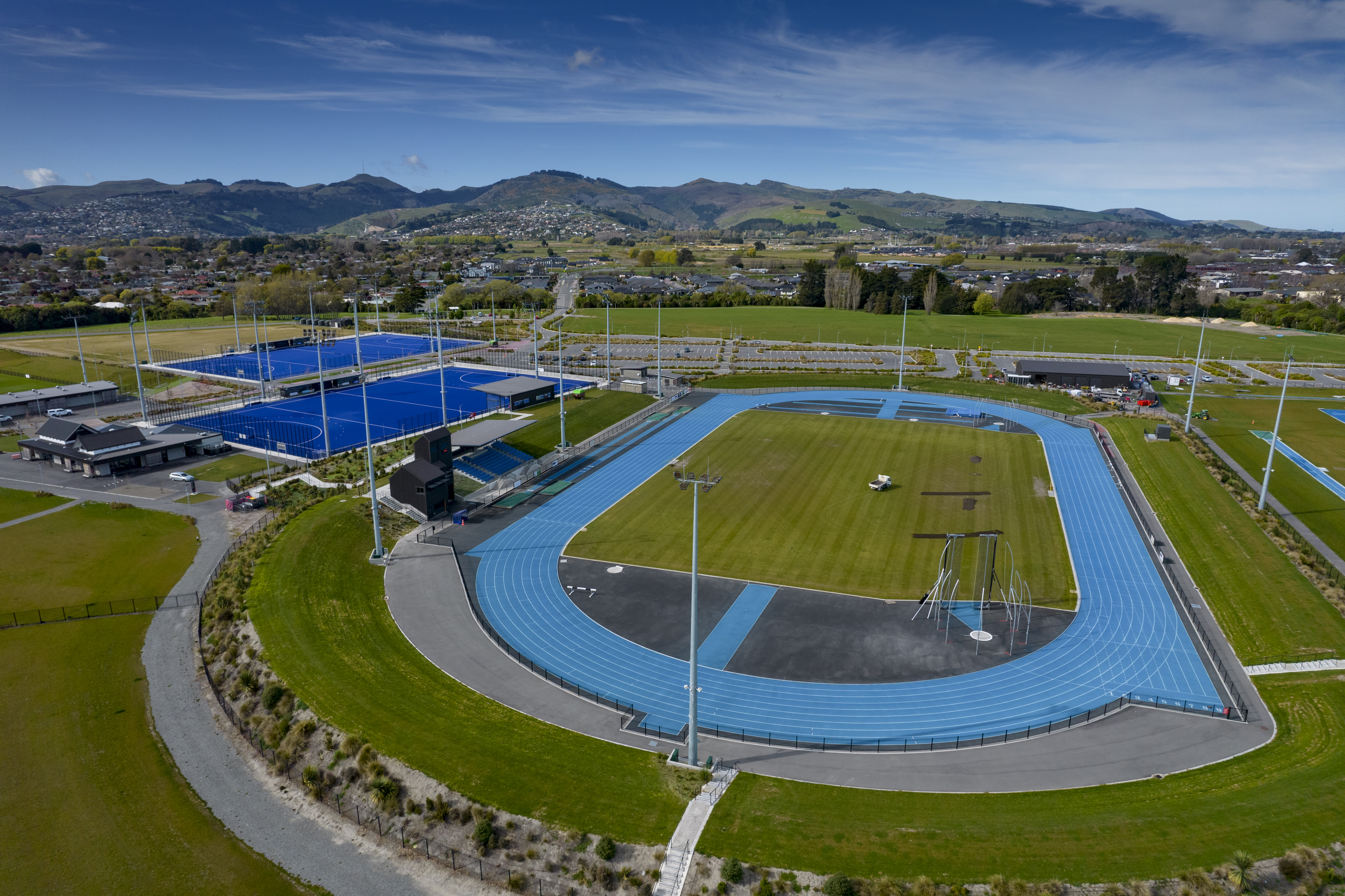 The outdoor Nga Puna Wai running track and blue tennis courts. 