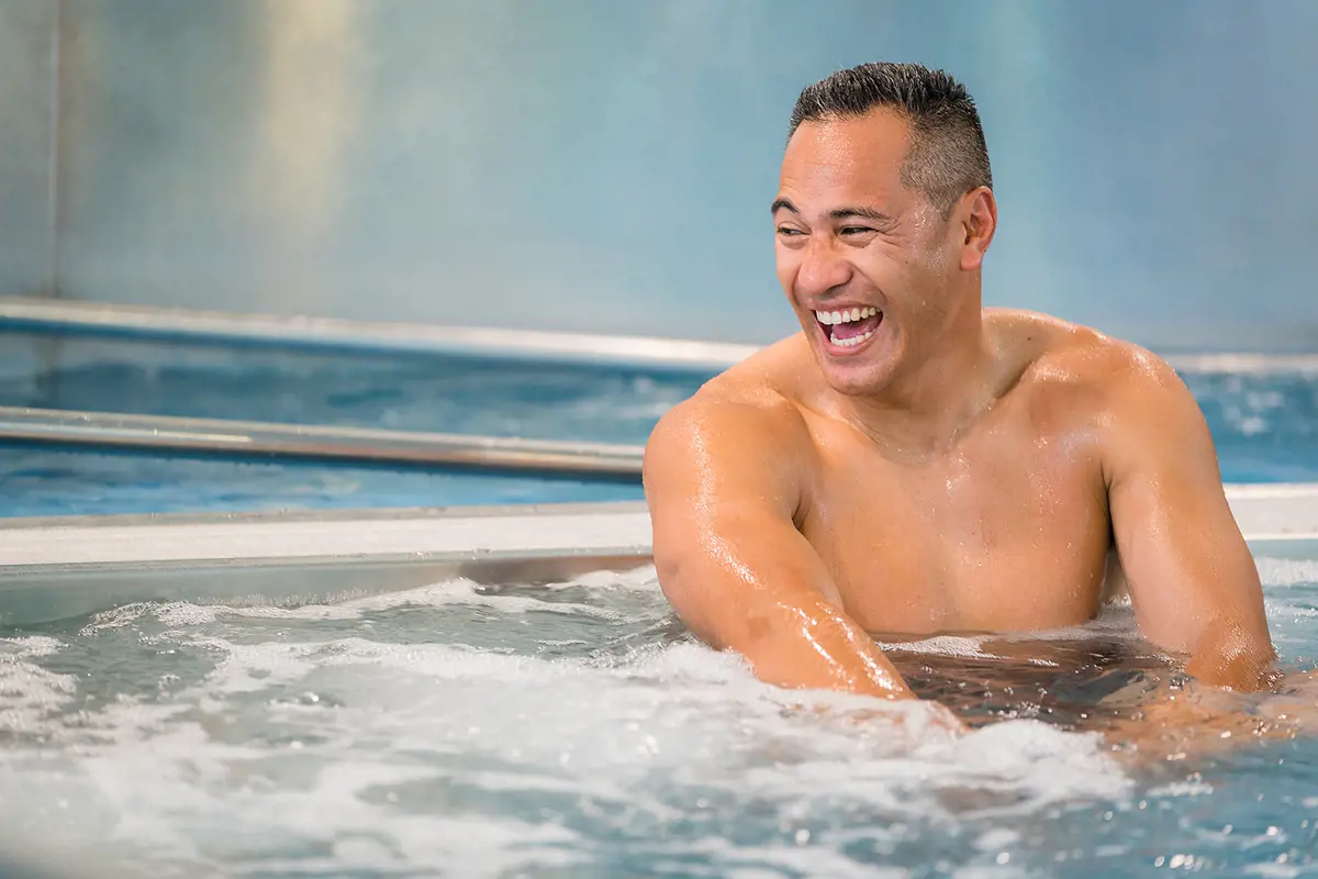 A man laughing in the spa at Jellie Park Rec Centre.